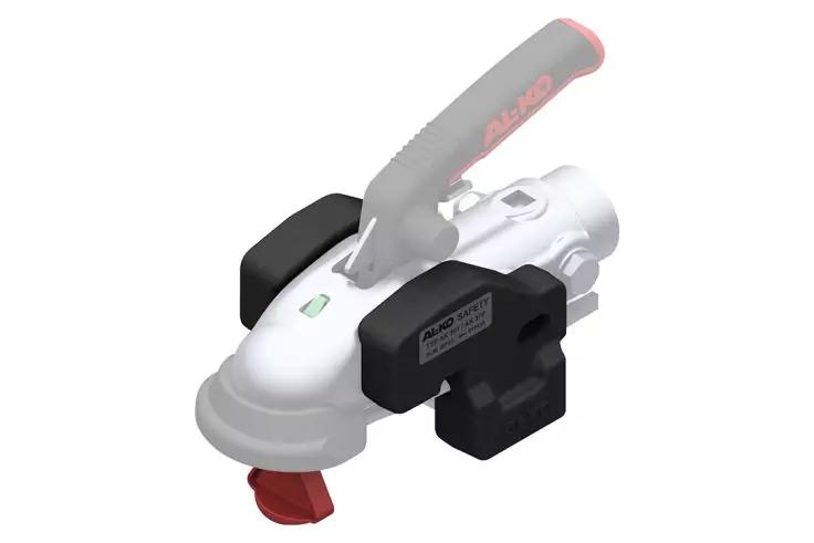 Weißes und schwarzes Bauteil mit grauem Hebel, rotem Zapfen vorne, kleinem grünen Quadrat auf der Oberseite und silbernem runden Anschluss hinten