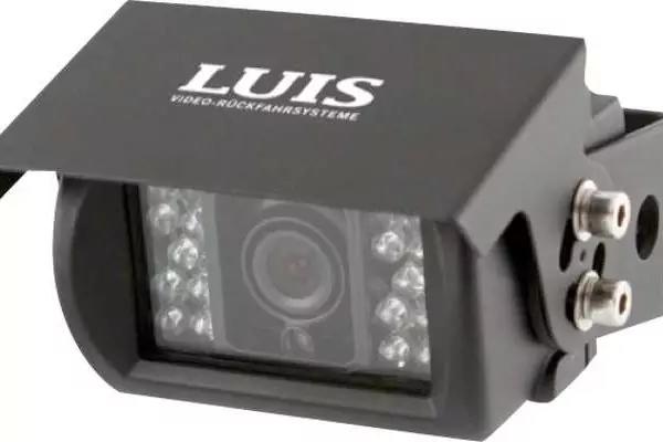 Schwarzes rechteckiges Gerät mit Metall-Schutzdach, vorne rundes Objektiv umgeben von mehreren kleinen LEDs, seitliche Metallhalterung mit Schrauben, weiße Aufschrift LUIS auf dem Dach