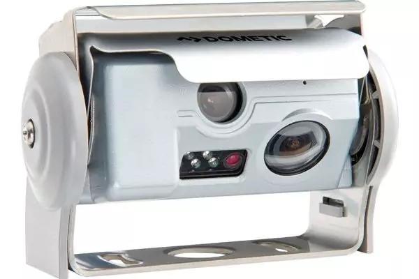 Weißes Metallgehäuse mit zwei Linsen, mehreren LED-Leuchten und verstellbarem Halter