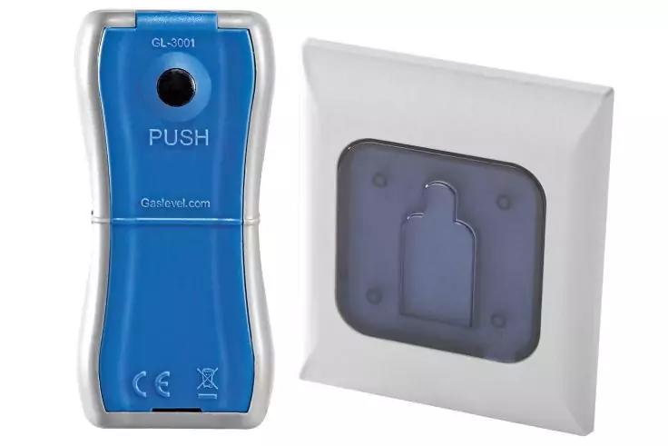 Blaues handgro&szlig;es Ger&auml;t mit silbernen Kanten, rundem Loch oben, Aufschrift 'PUSH' und CE-Symbolen; daneben ein wei&szlig;es quadratisches Teil mit dunkler Einlage und rechterckiger Aussparung