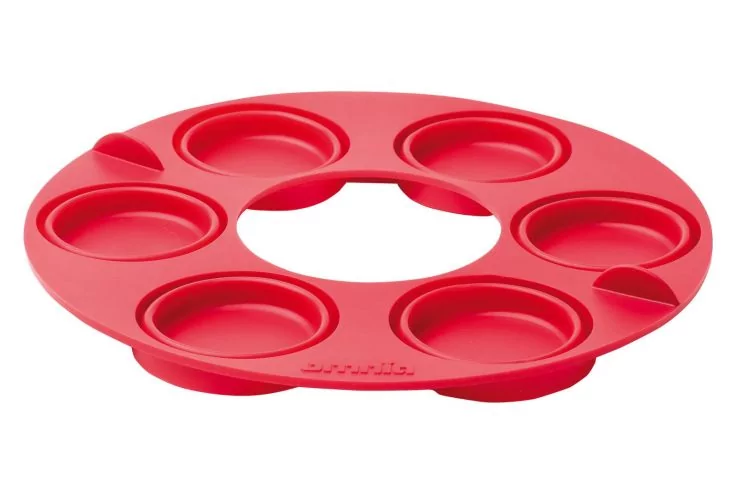 Roter runder Silikonring mit sechs runden Vertiefungen und einer &Ouml;ffnung in der Mitte