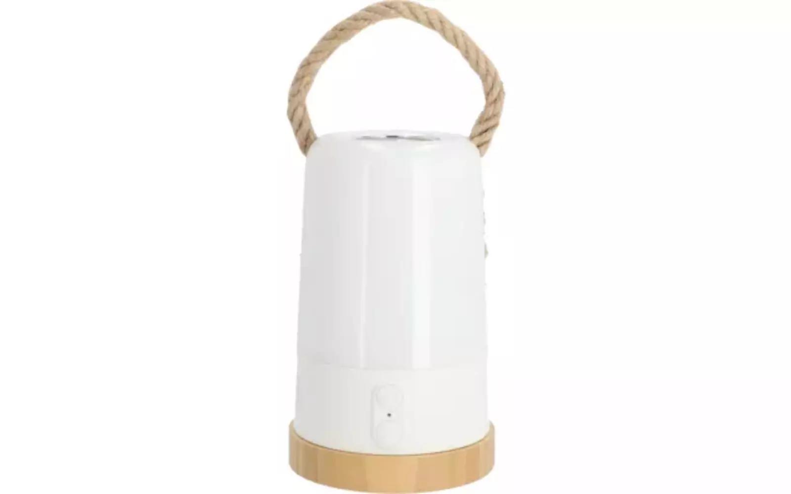 Wei&szlig;es zylindrisches Ger&auml;t mit hellem Holzsockel, geflochtenem Seilgriff oben und kleinem quadratischen Knopf an der Vorderseite