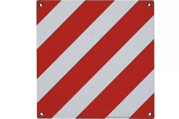 Plaque carr&eacute;e avec des bandes diagonales rouges et blanches et quatre trous de fixation aux angles