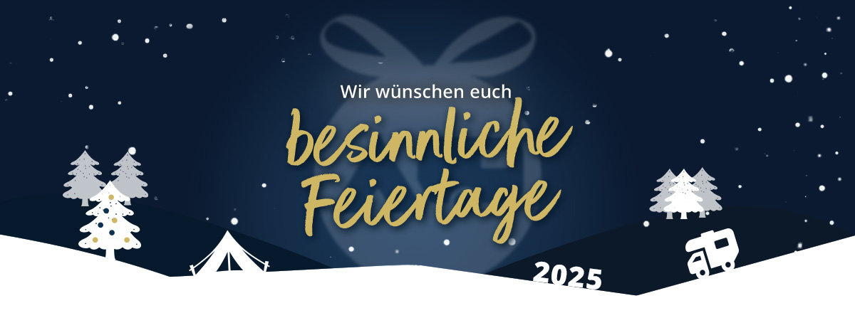 Winterliche Landschaft mit Tannenbäumen und froher Weihnachtsbotschaft auf Desktop