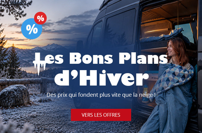 Paysage de montagne enneigé avec un lac, camping‑car garé à porte ouverte, une personne enveloppée dans une couverture assise dans l'embrasure, intérieur éclairé, texte superposé 'Winter Deals', icônes pourcentages et bouton rouge 'Zu den Angeboten'