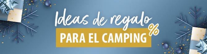 Vista exterior de una autocaravana azul frente a un bosque