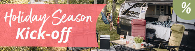 Happy family with child holding sign with text Vacation Start outdoors