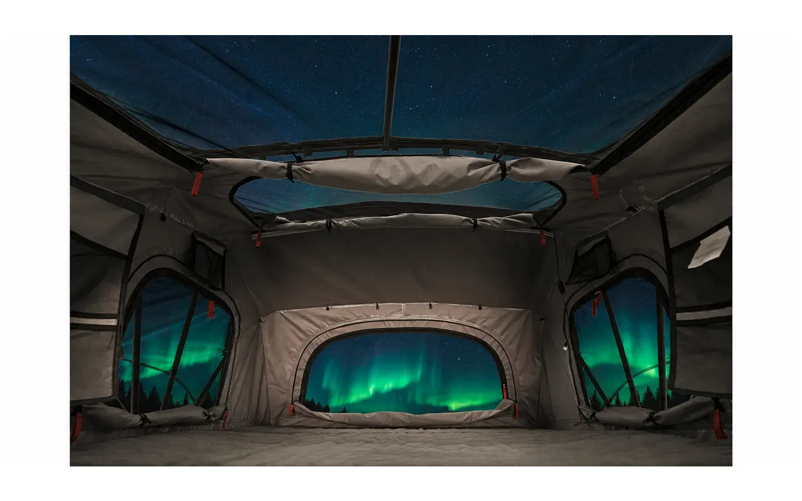 Ein Blick aus dem Dachzelt hinaus auf grüne Polarlichter