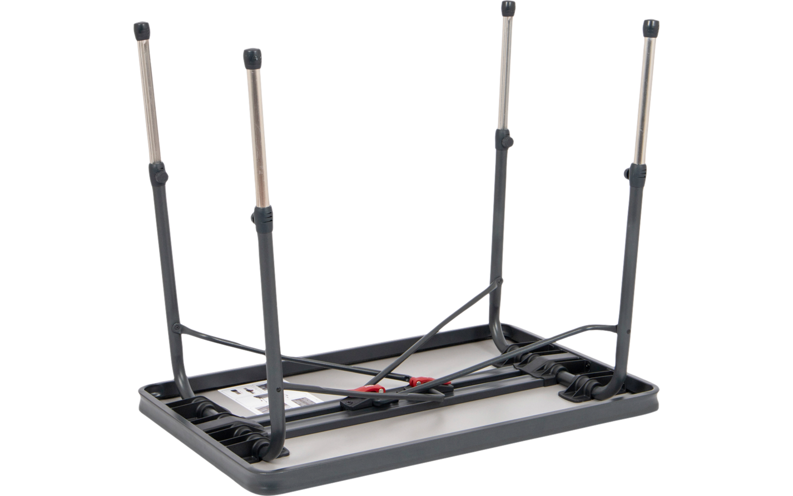 Ein schwarzer Klapptisch liegt mit der Tischplatte nach unten, die Beine sind nach oben ausgeklappt