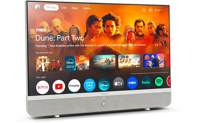TV a schermo piatto argentato con barra altoparlante inferiore su sfondo bianco; schermo mostra il poster "Dune: Part Two" e icone di app come Netflix, YouTube, Prime Video, Disney+, Apple TV, Max, Hulu e Spotify