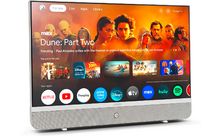TV a schermo piatto argentato con barra altoparlante inferiore su sfondo bianco; schermo mostra il poster "Dune: Part Two" e icone di app come Netflix, YouTube, Prime Video, Disney+, Apple TV, Max, Hulu e Spotify