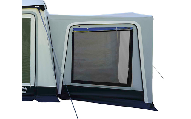 Large gray-green awning/tent with three rectangular windows, side annex with a window, guy lines and ground skirt