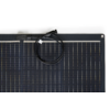 Top portion of a solar panel showing rectangular cells and a coiled black cable with connector on a white background