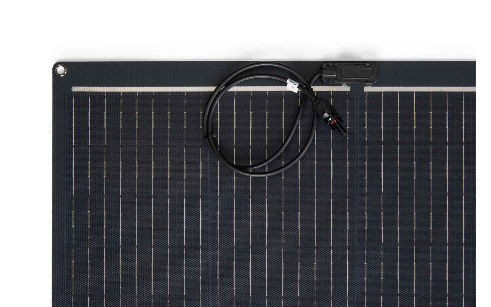 Top portion of a dark solar panel with cell lines, coiled cable with connector at top, metal eyelet in left corner, white background