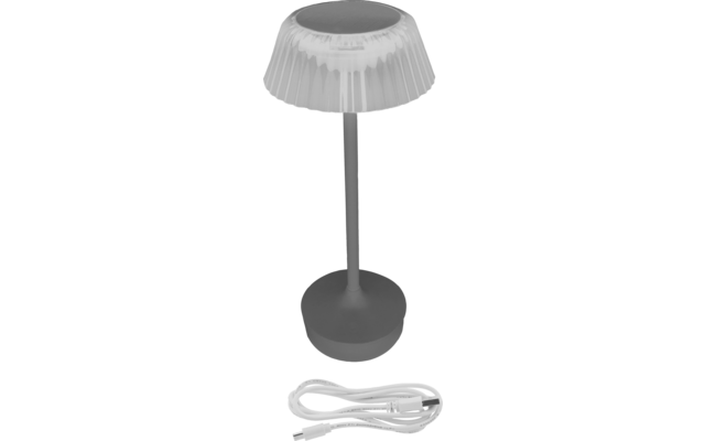 Tischlampe mit rundem Sockel, schlankem Ständer und transparentem, gefaltetem Lampenschirm; daneben aufgerolltes weißes Kabel mit Anschluss