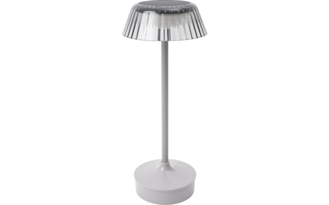 Lampada da tavolo con base rotonda, stelo sottile e paralume trasparente rigato