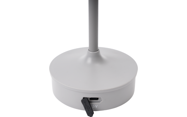 Base rotonda bianca con asta verticale, porta USB-C con copertura in gomma nera e scritta '5V'