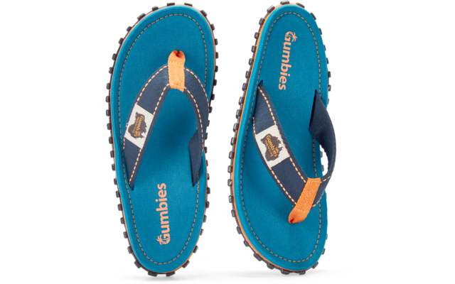 Pair of blue flip-flop sandals viewed from above, orange toe-post accents, dark blue straps with white patch, insoles with 'gumbies' logo, black treaded outsoles