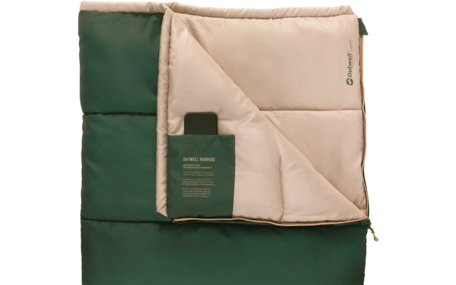 Zweifarbige Decke in Grün und Beige, teilweise umgeschlagen, mit einem kleinen Etikett und Text auf der beige Seite