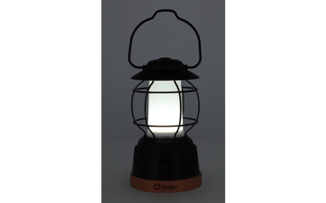 Une lanterne noire avec une lumière blanche brillante
