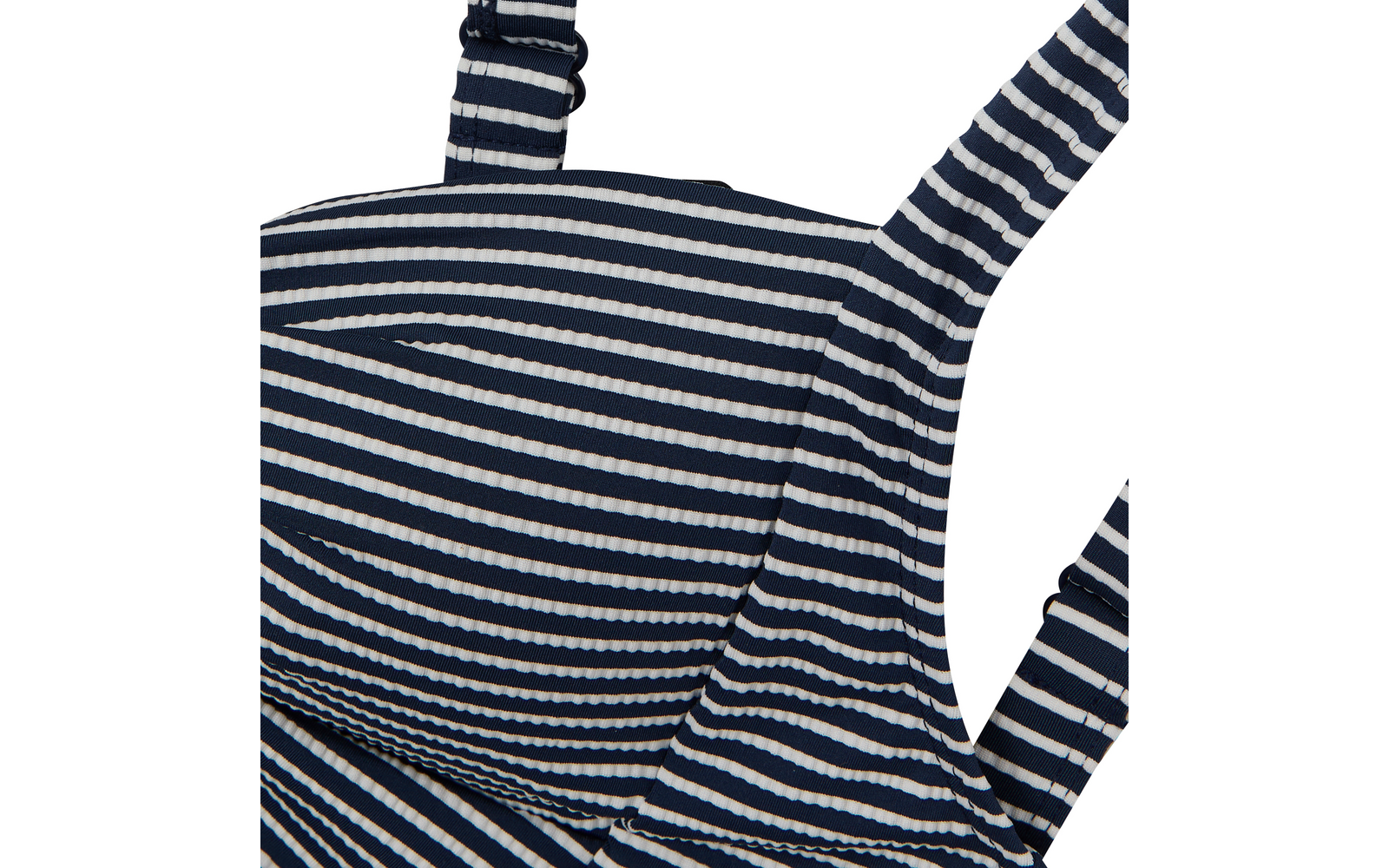 Gros plan d'un vêtement rayé bleu marine et blanc avec bretelles