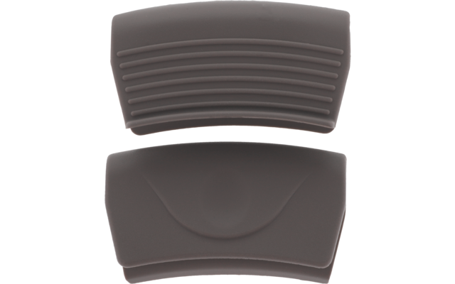 Zwei dunkelbraune, abgerundete Teile auf weißem Hintergrund; oberes Teil mit horizontalen Rillen, unteres mit glatter Fläche und zentraler bogenförmiger Vertiefung