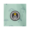 Ronde zwarte patch met witte anker, gele ster erboven, witte touwrand en tekst 'DESIGNED IN GERMANY' en 'ankerglück' op een mintgroene achtergrond met kleine paraplu-illustraties