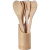 Bamboo utensils (spoons, spatula, fork-like utensil) in a round bamboo holder