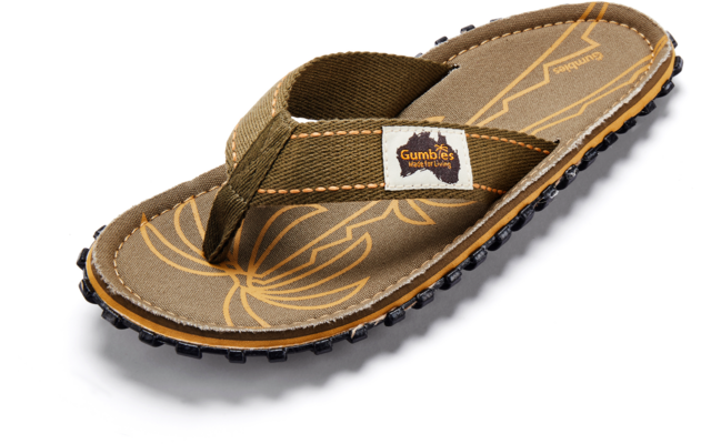 Brown flip‑flop sandal with olive fabric thong strap, small fabric label reading "Gumbies", light leaf pattern on the footbed, and black treaded sole