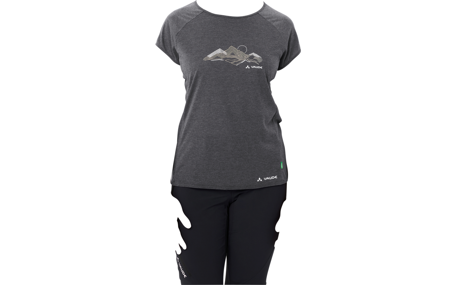 Person standing facing the camera against a white background, wearing a dark gray T‑shirt with a mountain graphic and black pants, hair pulled back