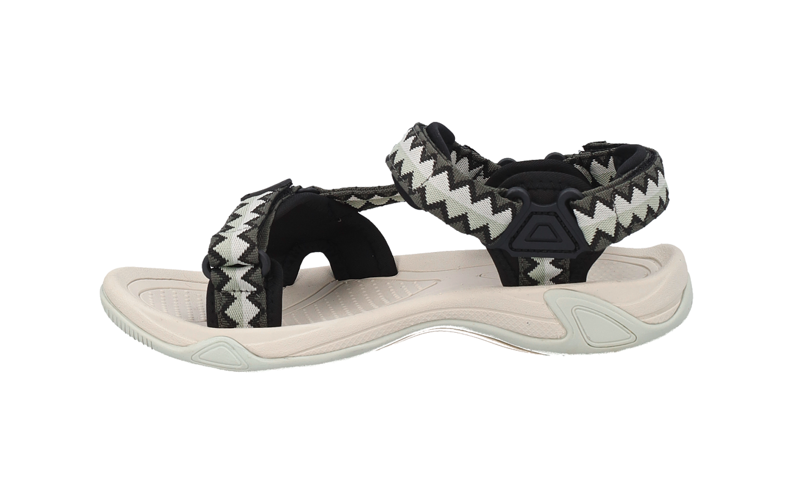 Eine einzelne Sandale mit hellbeiger Sohle, schwarzen Riemen mit weiß-grauem Zickzackmuster und Klettverschlüssen