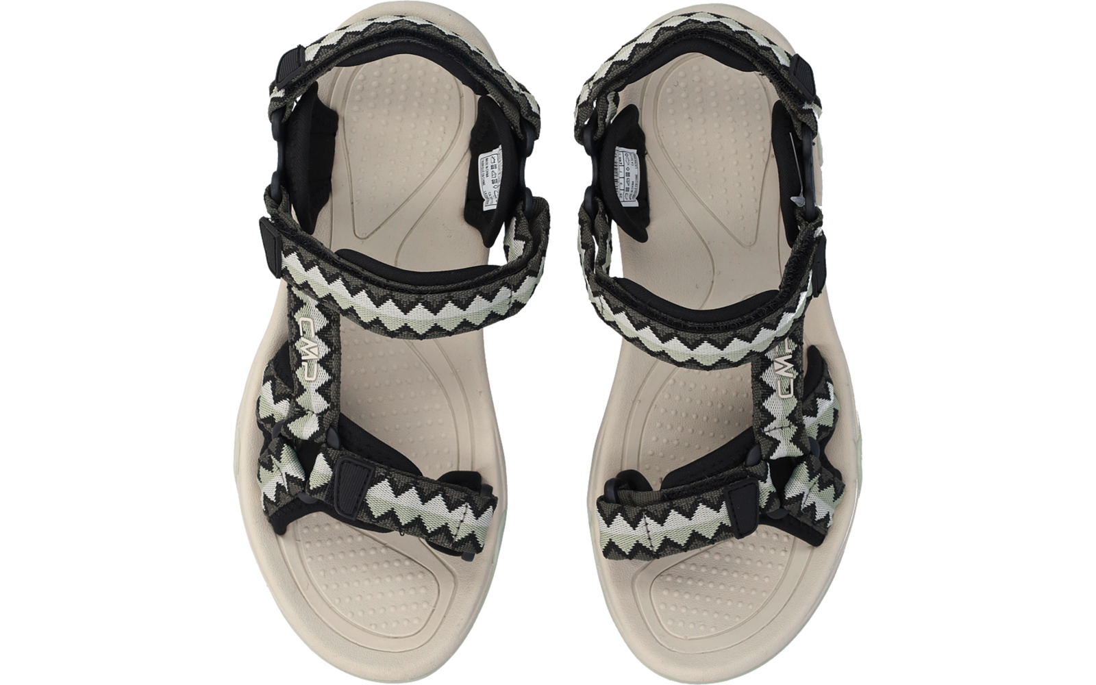 Zwei hellbeige Sandalen in Draufsicht, strukturierte Fußbetten, schwarze Riemen mit weiß-grünem Zickzackmuster und verstellbaren Laschen