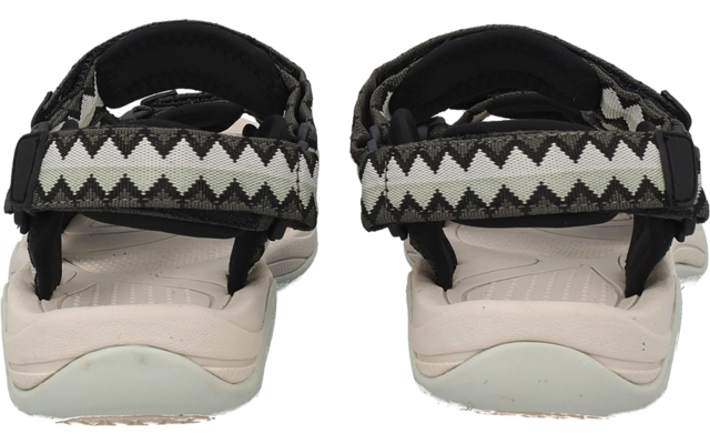Rückansicht eines Paares offener Sandalen mit hellen Fußbetten und schwarz-weiß gemusterten Klettriemen