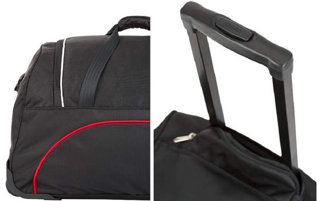 Schwarze Reisetasche mit roter Ziernaht, Tragegriff, Metallreißverschluss und ausgezogenem Teleskopgriff