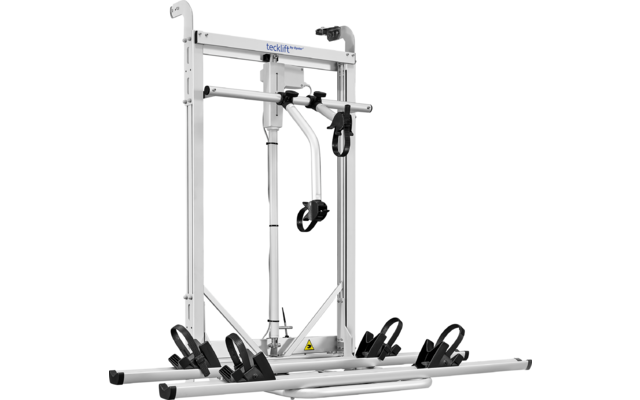 Cadre métallique blanc-argenté avec deux montants verticaux, traverse supérieure avec texte bleu 'tecklift', élément cylindrique central, deux bras métalliques courbés avec sangles noires et une plateforme inférieure avec quatre supports noirs