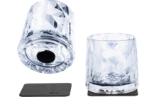 Two faceted clear drinking glasses, one upright on a black square coaster, the other upside down beside a second black square coaster on a white background
