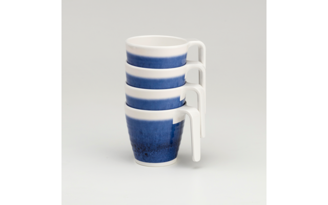 Four stacked white cups with blue bands, handles on the right