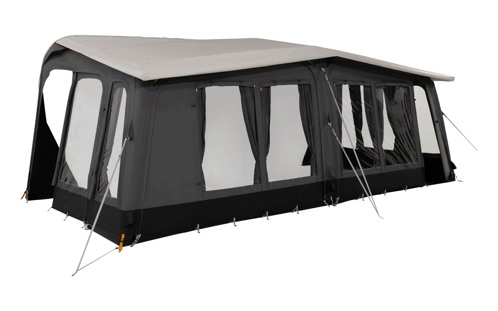 Large black tent with beige roof, multiple windows with light-colored curtains, guy lines and ground anchors