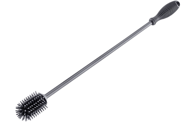 Vástago metálico largo y delgado con mango de plástico acanalado y cabezal de cepillo redondo con cerdas densas sobre fondo blanco