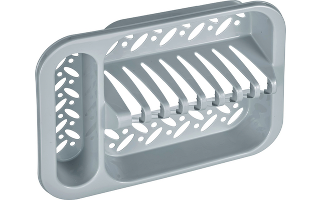 Pièce rectangulaire en plastique gris avec plusieurs nervures parallèles, un compartiment vertical à gauche et des ouvertures ovales