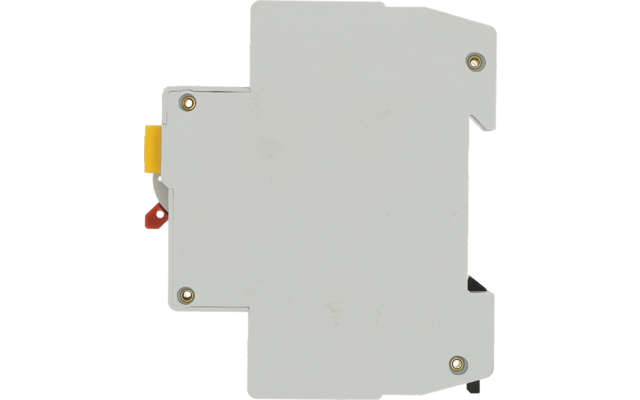 Boîtier en plastique blanc rectangulaire avec quatre vis dorées visibles, petites pièces en plastique jaune et rouge à gauche, quelques traces de saleté