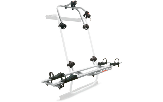 Zilverkleurig metalen frame met twee verticale stangen, twee horizontale rails, zwarte kunststofhouders en riemen, twee slotcilinders met sleutels, gemonteerd op een lichte achterklep