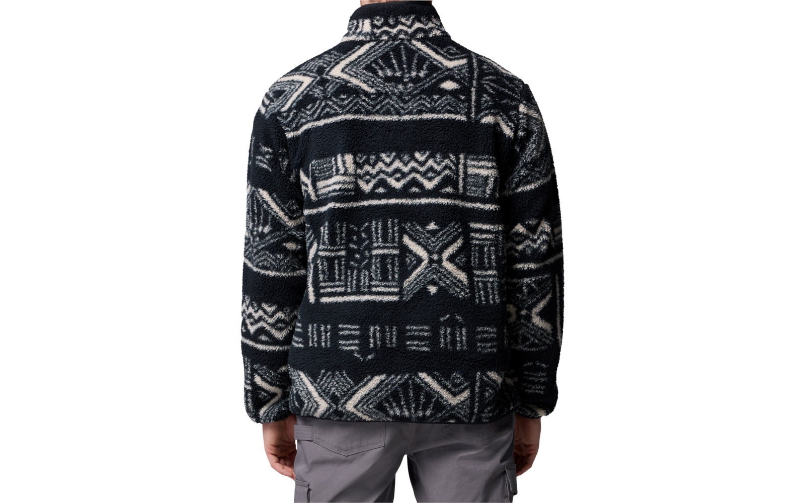 Person von hinten mit dunkelblauer Jacke mit weißen Mustern