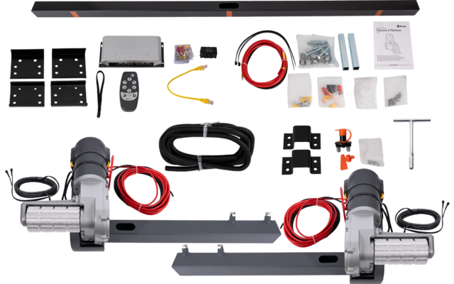 Dos rodillos plateados con carcasa negra, cables rojo y negro, larga barra metálica negra en la parte superior, mando a distancia, varias piezas metálicas negras y plateadas, tornillos en pequeñas bolsas de plástico, manual de instrucciones
