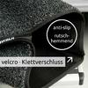 Nahaufnahme eines grauen, strukturierten Teppichstücks mit schwarzem Klettverschluss auf einer Metallstufe; sichtbare Texte 'anti-slip rutschhemmend' und 'velcro · Klettverschluss'