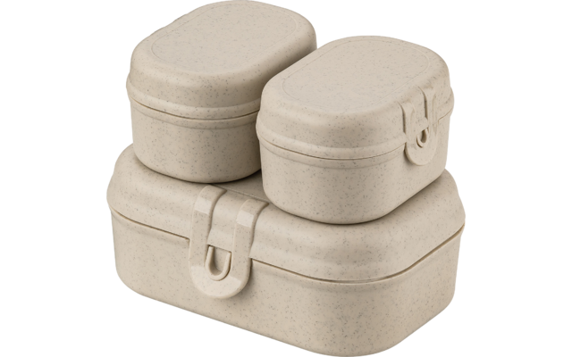 Trois boîtes empilées beige à motif moucheté, de forme rectangulaire arrondie ; deux petites en haut, une plus grande en bas ; fermoirs-pression visibles à l’avant