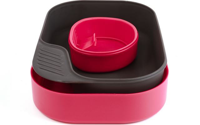 Tres cuencos anidados en rosa y negro sobre fondo blanco