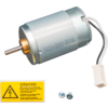 Ein grauer Elektromotor mit zwei Kabeln und einem weißen Stecker, darunter ein gelbes Warnschild und zwei Schrauben