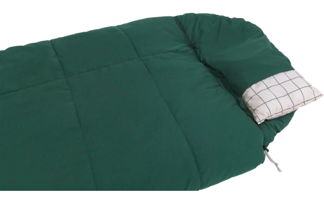 Grüner Schlafsack mit kariertem Kissen