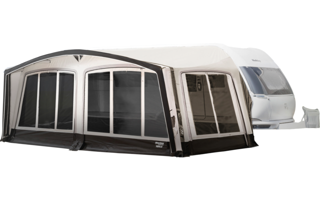 White caravan with a gray front awning and several large windows